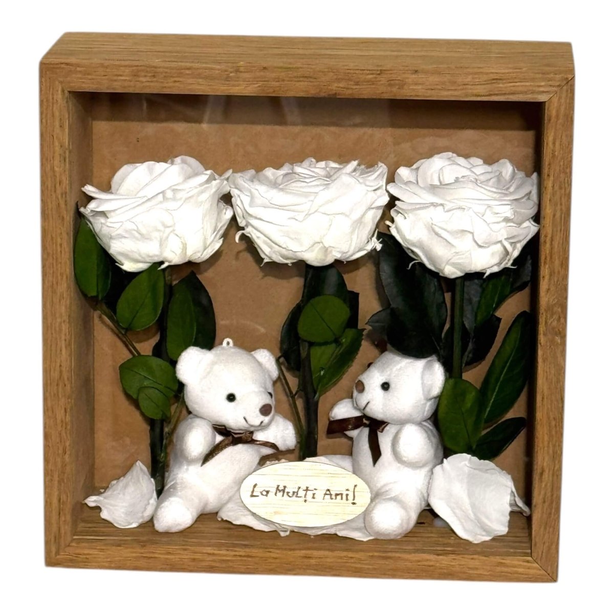 Tablou decorativ cu flori criogenate albe și ursuleți de pluș, perfect pentru exprimarea afecțiunii și eleganței în decorul casei.